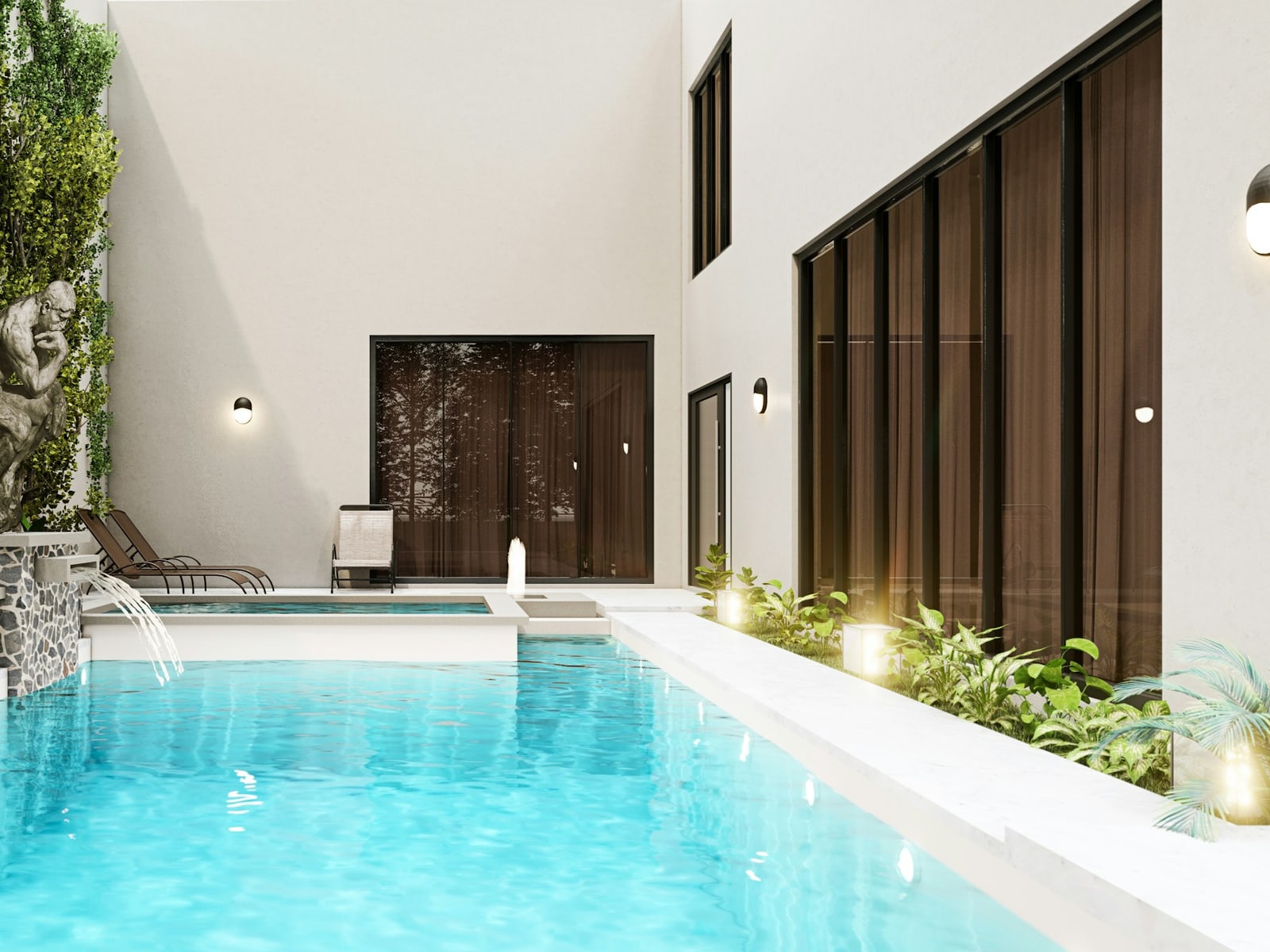 Sparkling courtyard pool framed by white walls and greenery